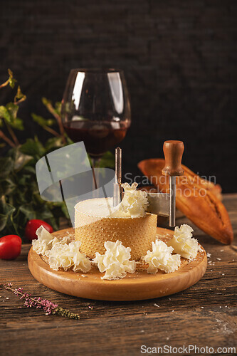 Image of Slicing cheese on wooden board