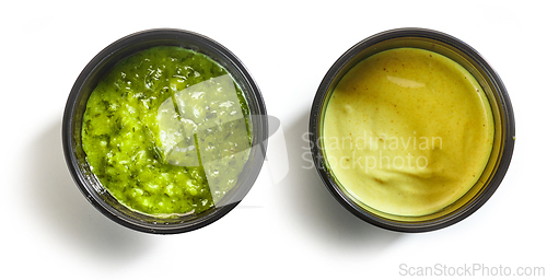 Image of two sauces in plastic cups