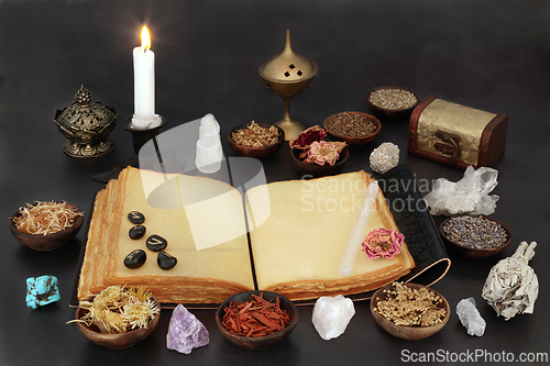 Image of Witches Crystals Runes and Herbs with Book of Spells 