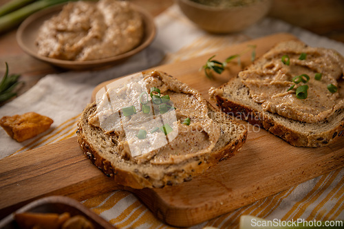 Image of Two slices of bread with spread
