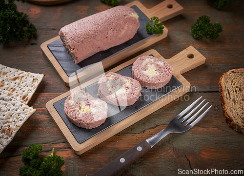 Image of Sliced ham pate roll with eggs