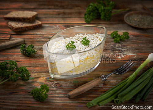 Image of Grated eggs and cheese layered with polenta