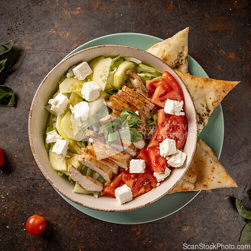 Image of Bowl of fresh salad with grilled chicken