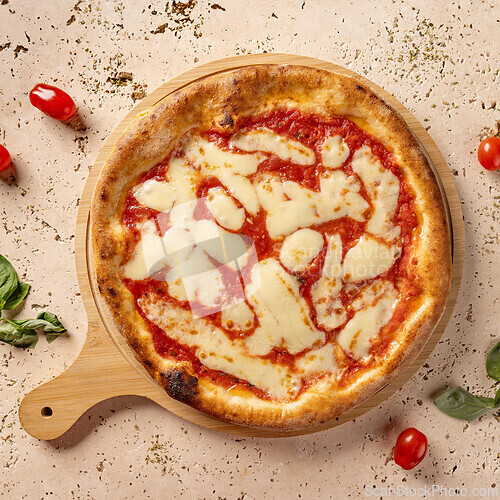 Image of Freshly baked pizza margherita