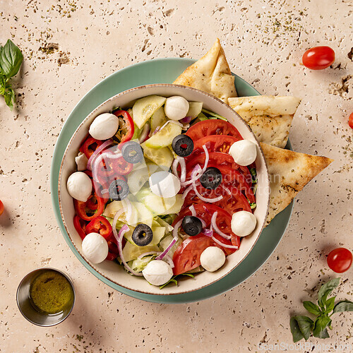 Image of Delicious fresh salad with mozzarella