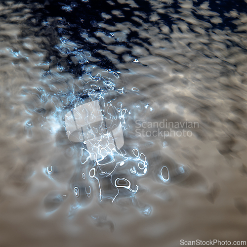 Image of Water surface with reflections of lights. Abstract background