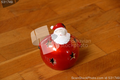 Image of Christmas candlestick on parquet floor