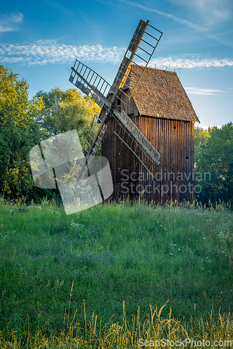 Image of Old wooden windmill in the morning sun