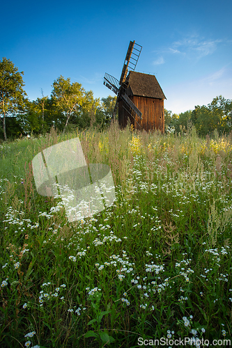 Image of Old wooden windmill in the morning sun