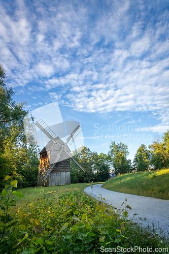 Image of Old wooden windmill in the morning sun