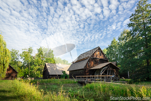 Image of Old wooden water mill in the morning sun