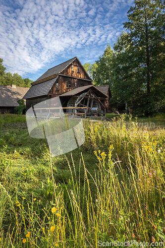 Image of Old wooden water mill in the morning sun