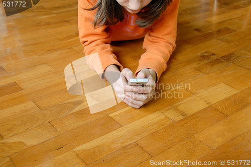 Image of Teen girl with mobile phone