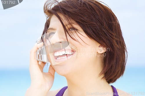 Image of happy woman with white phone