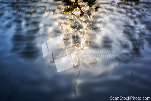 Image of Water surface with reflections of lights. Abstract background