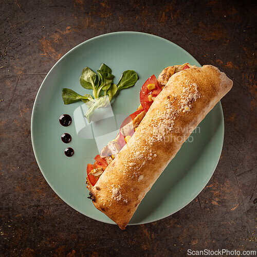 Image of Fresh ciabatta with juicy tomatoes