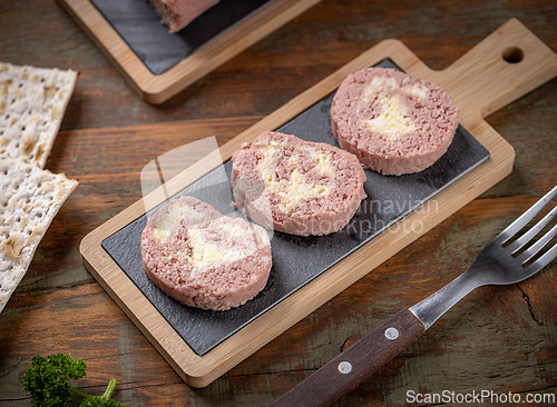 Image of Slices of savory meatloaf with egg filling