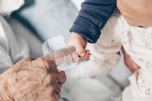 Image of Circle of life. Little baby boy child hand holding great grandmother wrinkled finger. Intergenerational help and solidarity concept