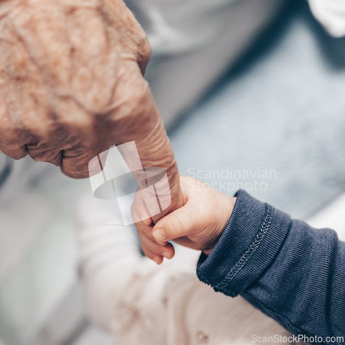 Image of Circle of life. Little baby boy child hand holding great grandmother wrinkled finger. Intergenerational help and solidarity concept
