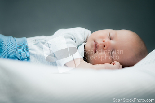 Image of Close-up portrait of adorable baby boy sleeping in bed, 1 year old baby concept