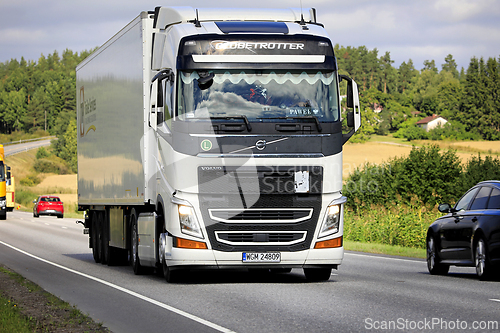 Image of White Volvo FH Truck Semi Trailer in Highway Traffic