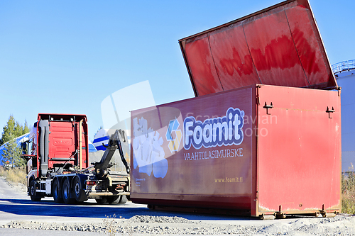 Image of Volvo Hooklift Truck and Detached Foamit Foam Glass Transport Tr