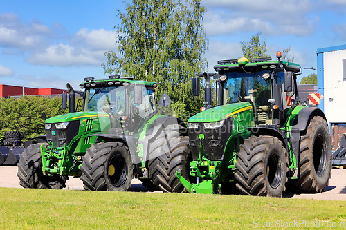 Image of Two John Deere Agricultural Tractors Parked