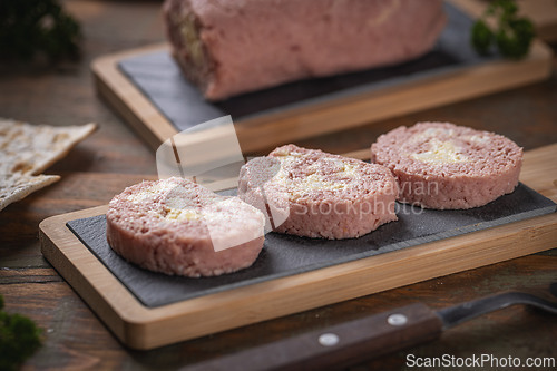 Image of Slices of savory meatloaf with egg filling