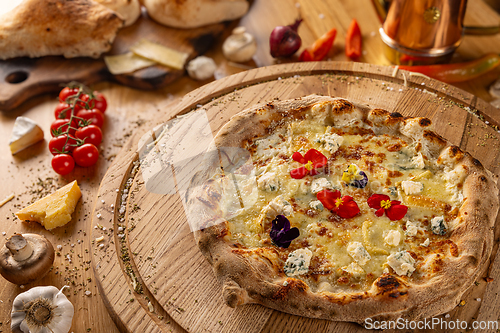 Image of Studio shot of pizza Quattro Formaggi