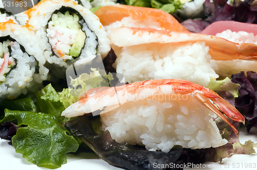 Image of sushi sashimi with california rolls