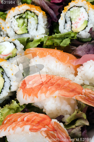 Image of sushi sashimi with california rolls