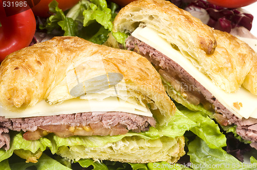 Image of gourment roast beef sandwich on croissant