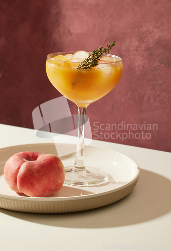 Image of glass of iced peach juice