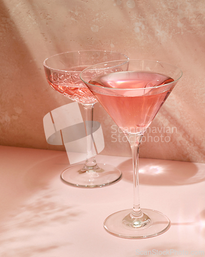 Image of various glasses on pink background
