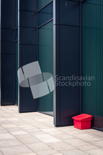 Image of A red box next to a modern building