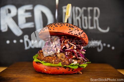 Image of Fresh colorful vegan burgers with vegetables on counter at summer local food market - close up view. Outdoor cooking, gastronomy, vegetarian, street food concept.