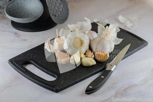 Image of Garlic on cutting board close-up