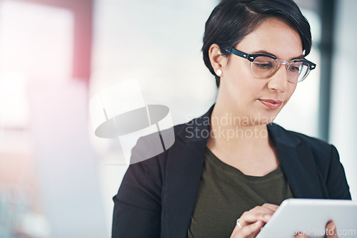 Image of Business woman, research and browsing with tablet for online news, data or corporate statistics at office. Female person or employee scrolling and reading on technology for review, feedback or report