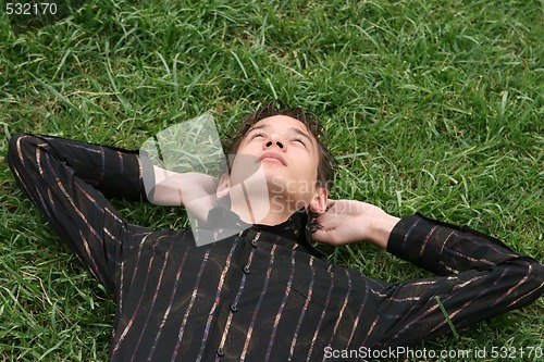 Image of relaxing on grass