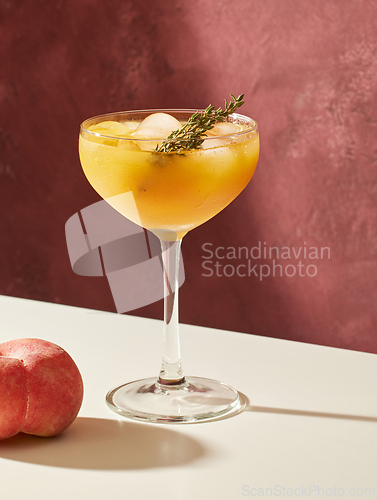 Image of glass of iced peach juice