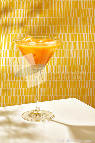 Image of glass of peach juice
