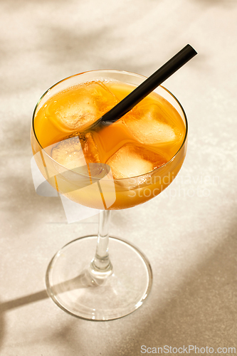 Image of glass of iced orange drink