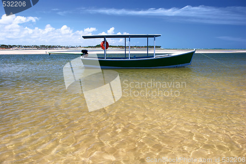 Image of Boat in crystalline clear sea in Brazil