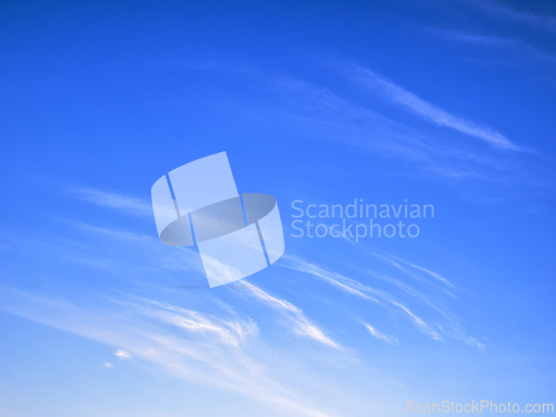Image of White clouds on bright blue sky, high stratospheric light white 
