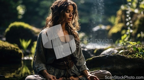 Image of Serene Woman Meditating in Lush Forest at Sunrise