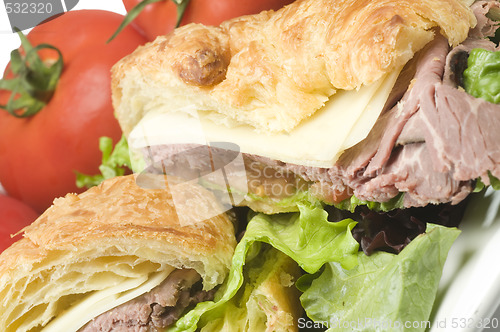 Image of gourment roast beef sandwich on croissant