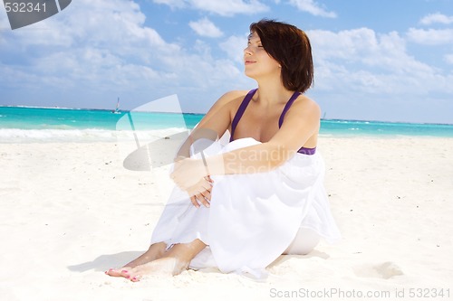 Image of happy woman with white sarong