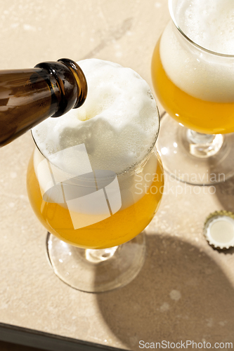 Image of beer pouring into glass