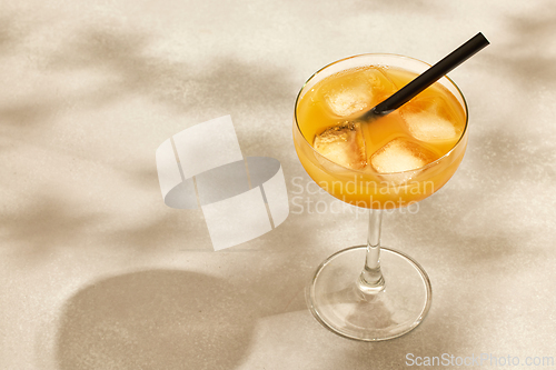 Image of glass of iced orange drink