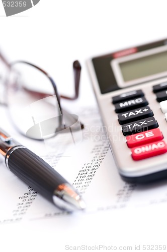 Image of Tax calculator pen and glasses